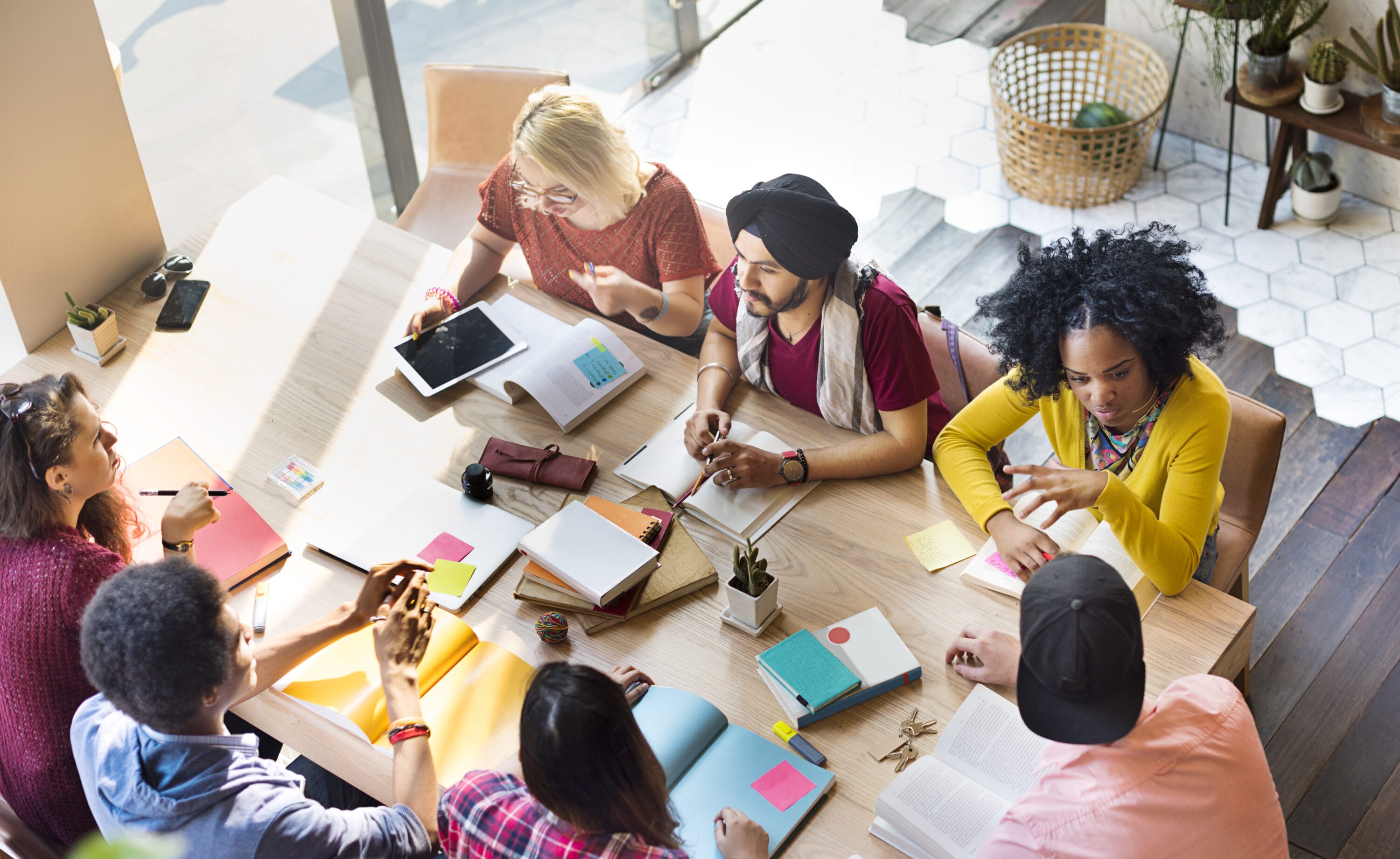 A group of young adults working together.