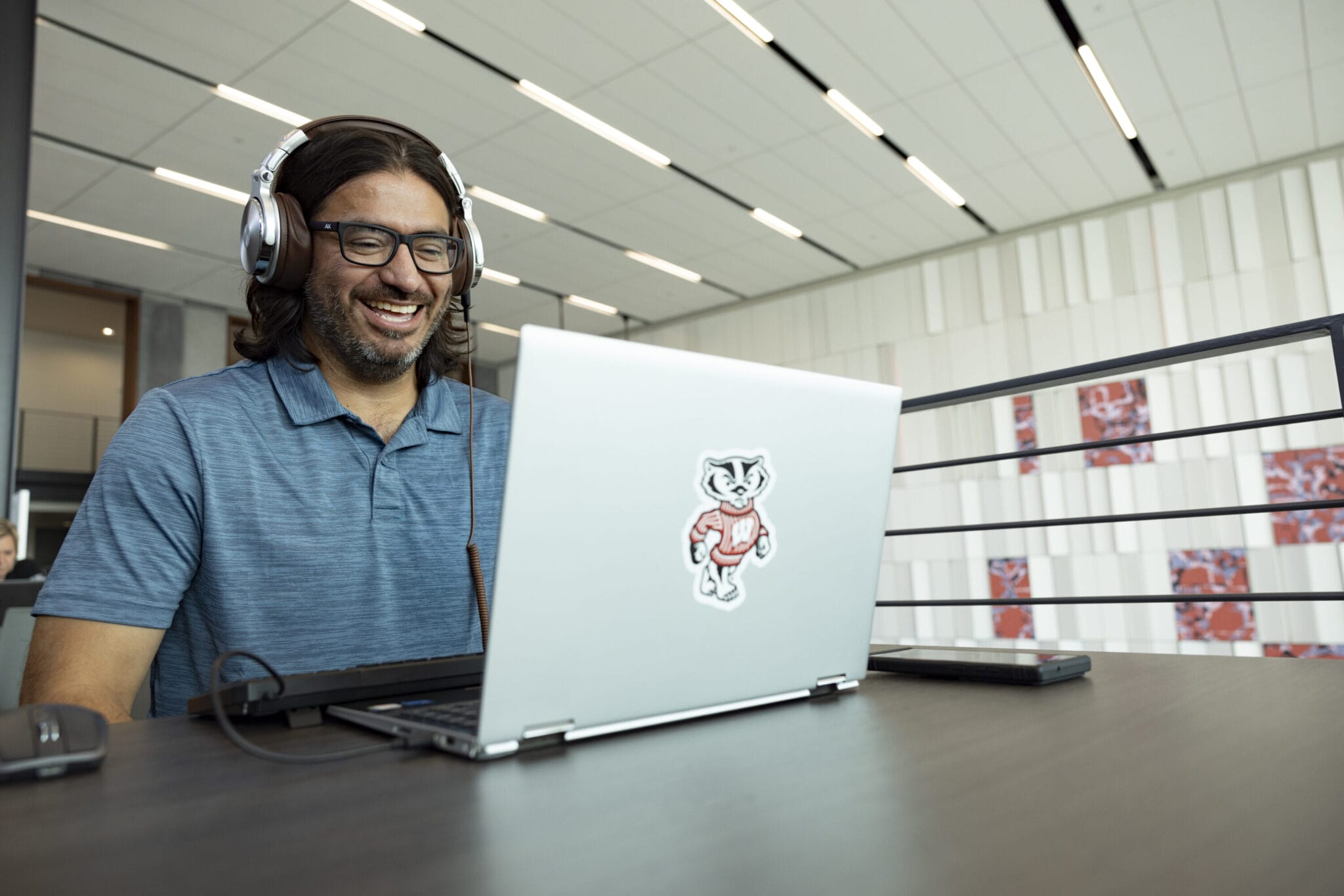 Manny Avila in front of his laptop.