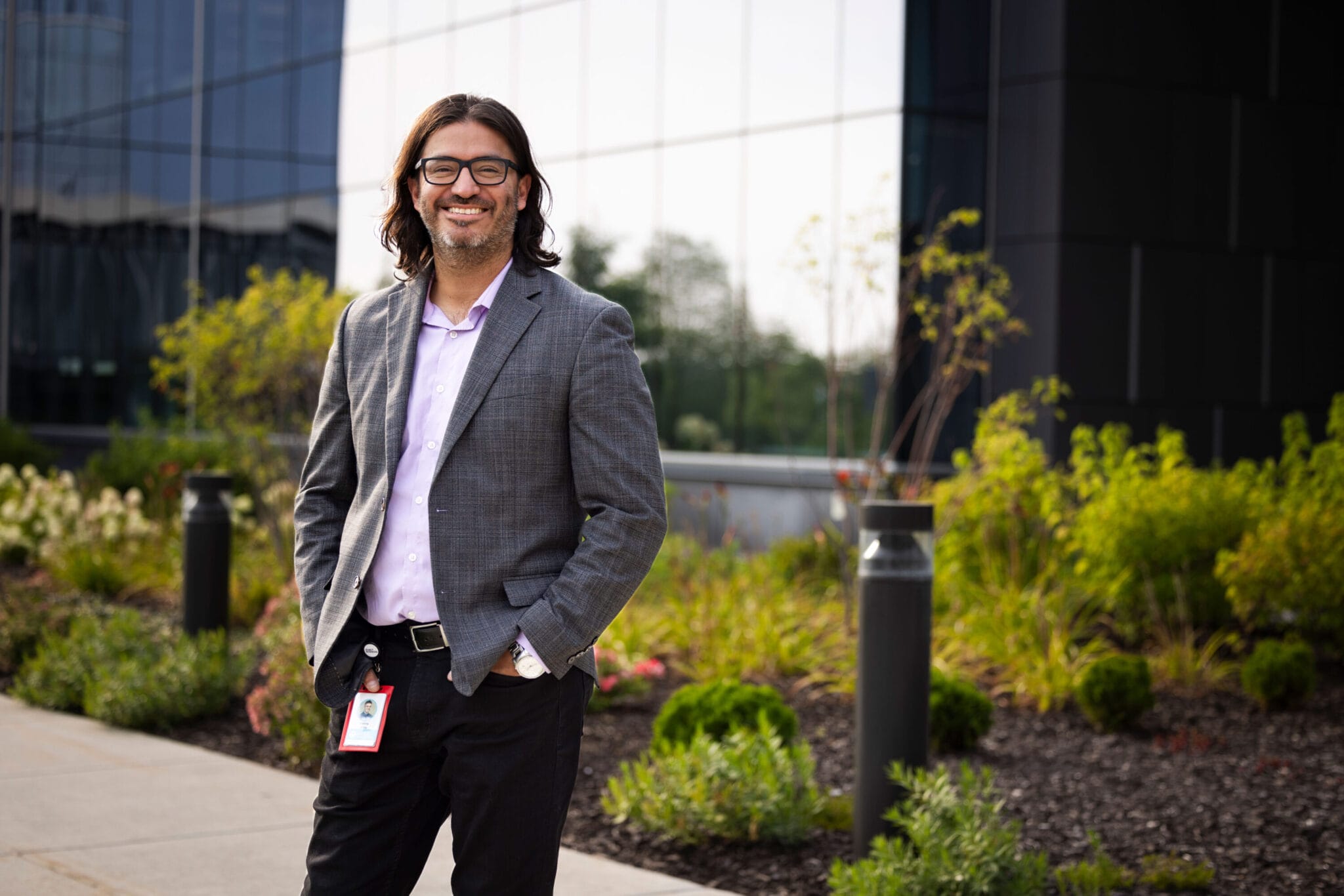 UW-Madison Online alumni Manny Avila standing in front of the Epic headquarters