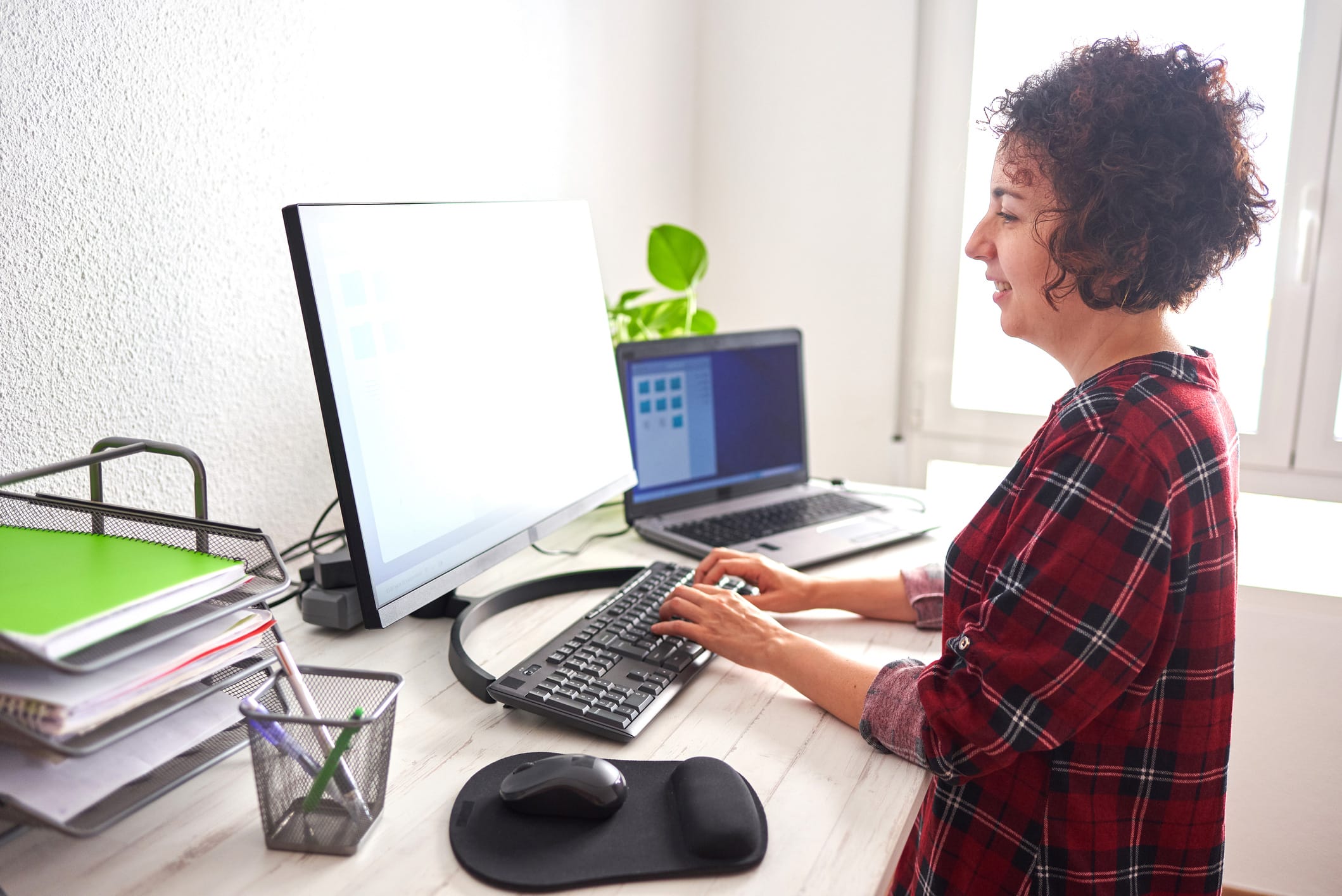 A woman working in her home office.