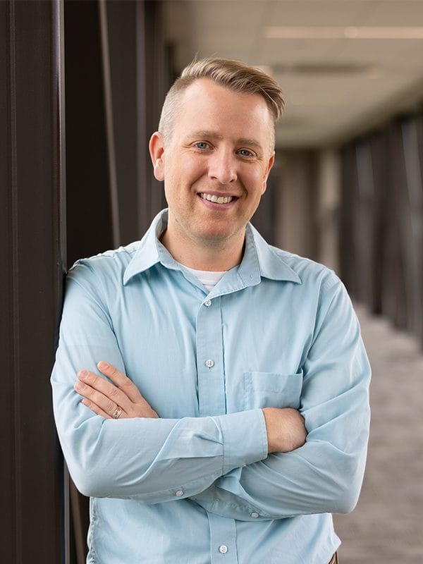 headshot of john gloeckler, smiling