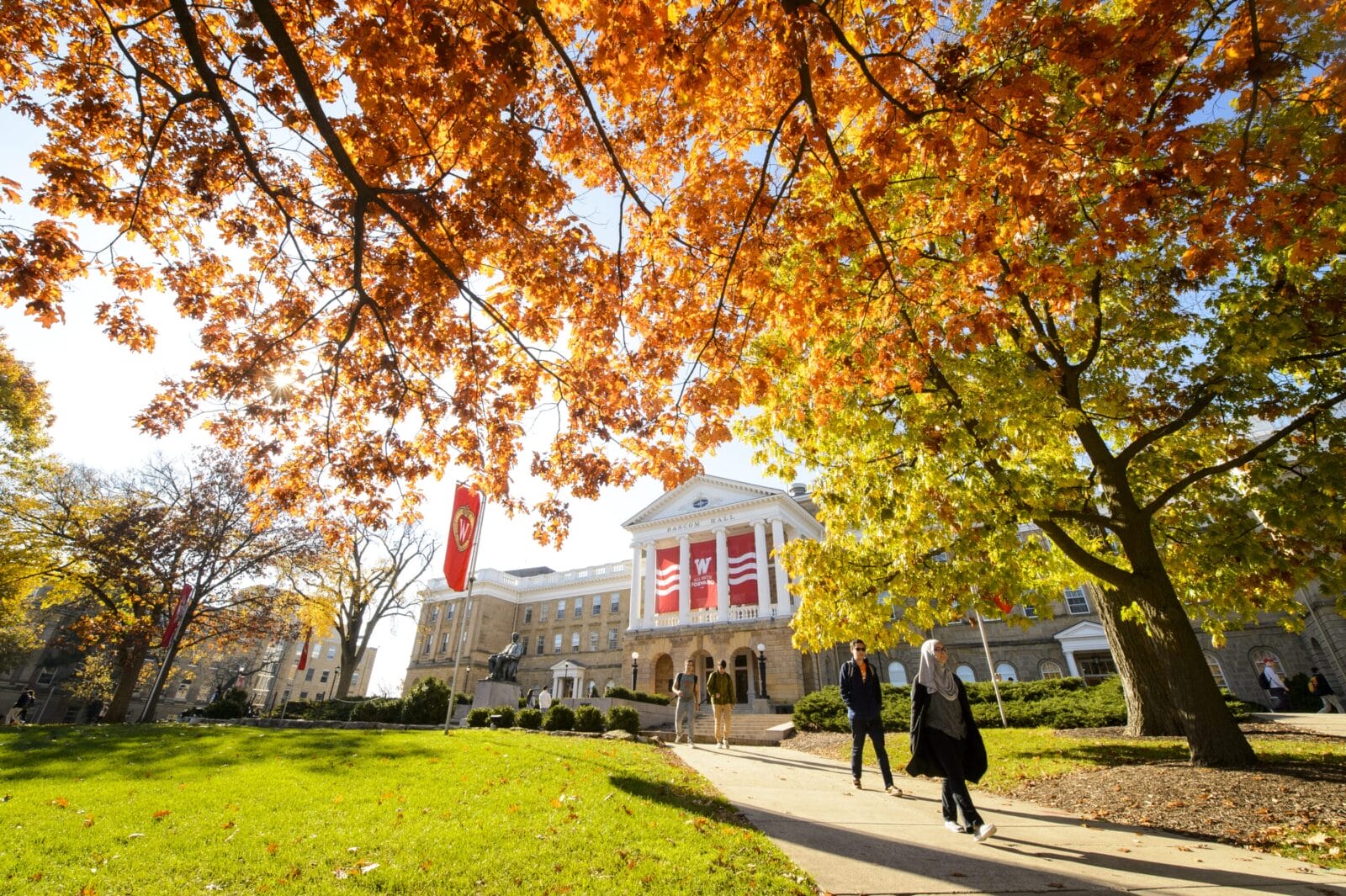 Bascom hall in fall with students leaving