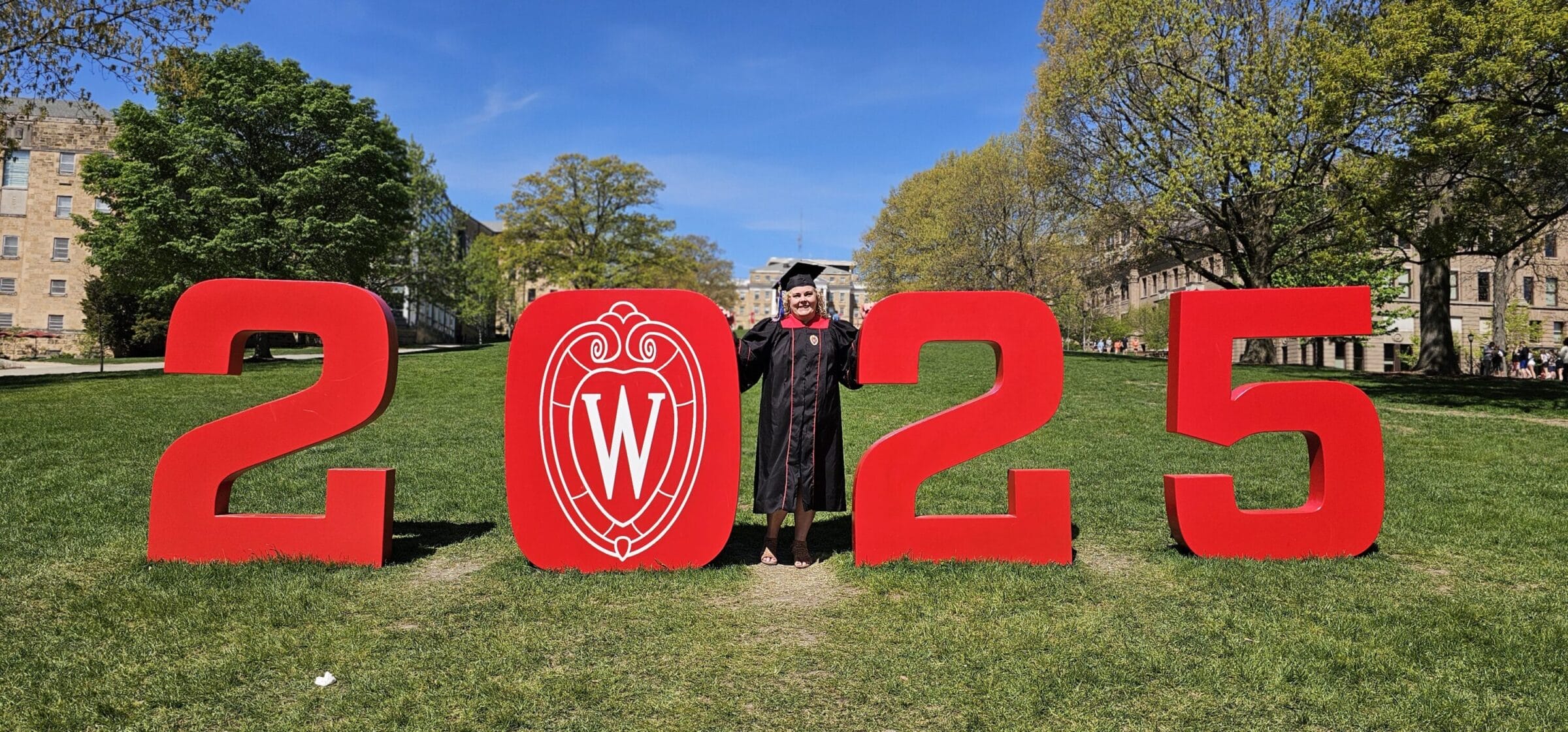 Rachel Kane posing for a graduation picture